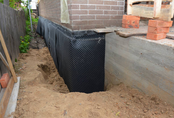 SJ Waterproofing Pros technician performing targeted Emergency Waterproofing assessment in Cambridge, OH